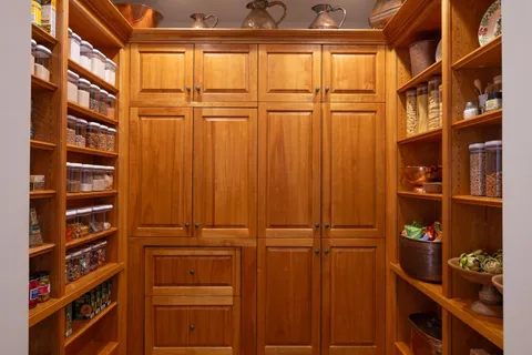 a view of workspace with wooden floor windows cabinet