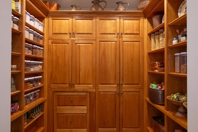 a view of workspace with wooden floor windows cabinet