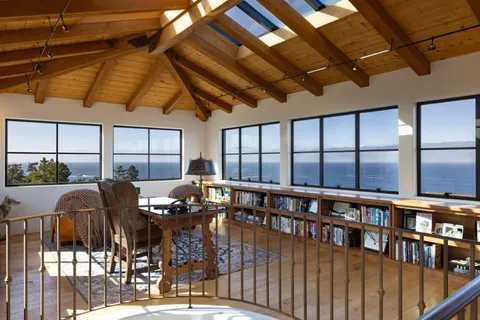 a bedroom with a bed with wooden roof