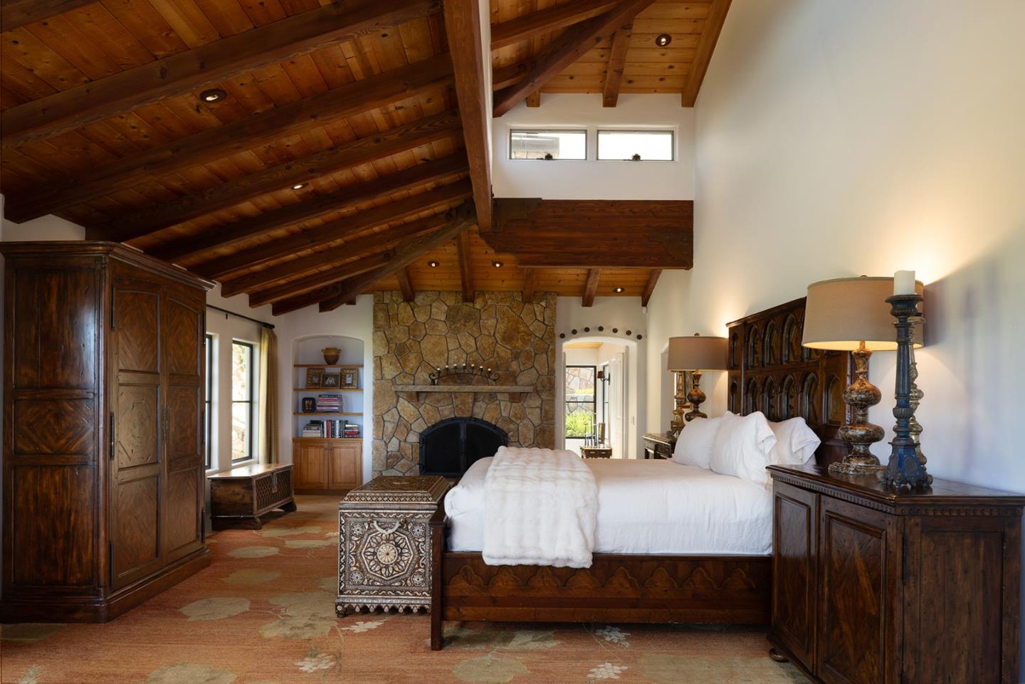 31453 Highway 1 Carmel, CA 93923 - Photo 33 of 58 a bed room with a bed and a mirror