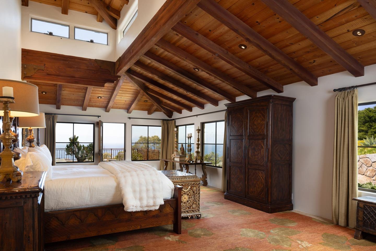 31453 Highway 1 Carmel, CA 93923 - Photo 34 of 58 a bedroom with a bed with wooden roof