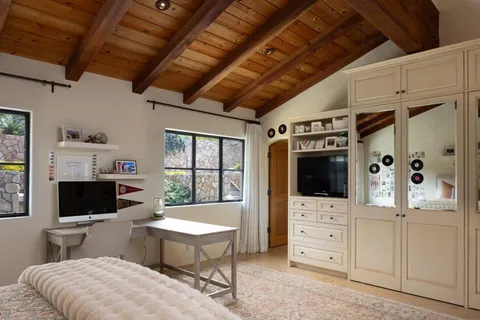 a view of a room that has a table and chairs