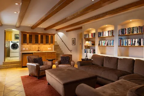 a bathroom with a shower sink vanity and mirror