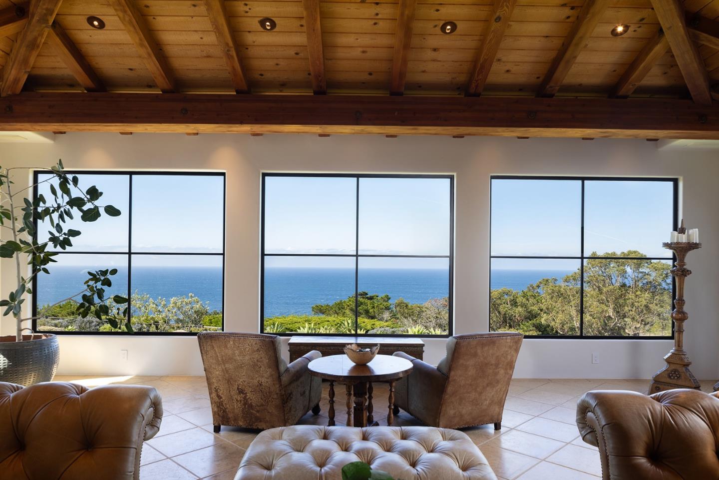 31453 Highway 1 Carmel, CA 93923 - Photo 9 of 58 a view of a balcony with table and chairs potted plants