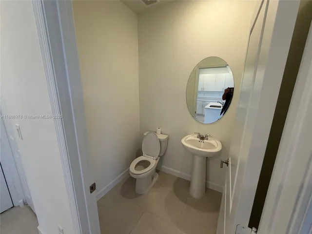 a kitchen with stainless steel appliances a sink stove and cabinets