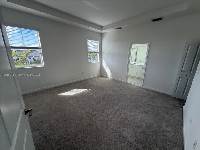 a bathroom with a shower sink and mirror