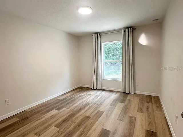 a view of an empty room and window