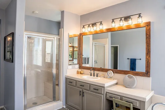 a bathroom with a sink and a mirror