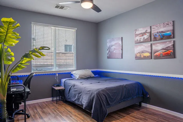 a bedroom with a bed and a window