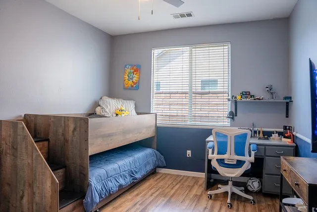 a bedroom with furniture and a window
