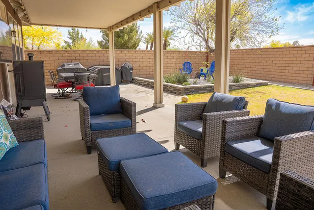 a outdoor living space with patio furniture and a potted plant