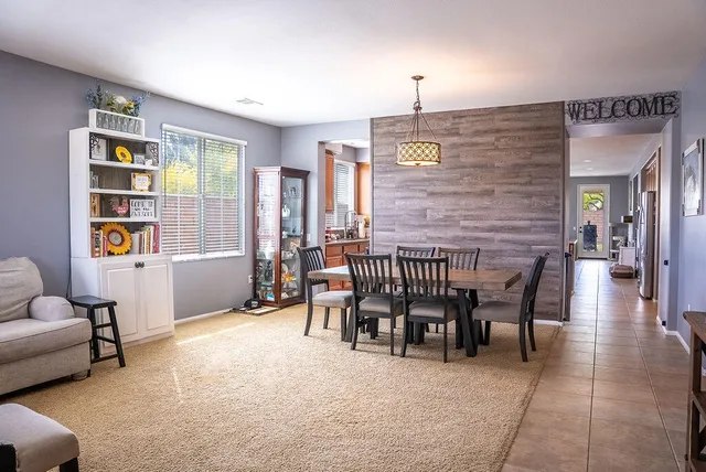 a dining room with furniture and window