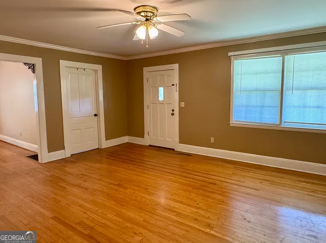a kitchen with granite countertop a refrigerator and a sink