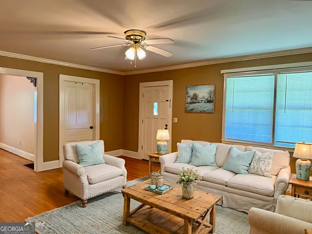 an empty room with closet and windows