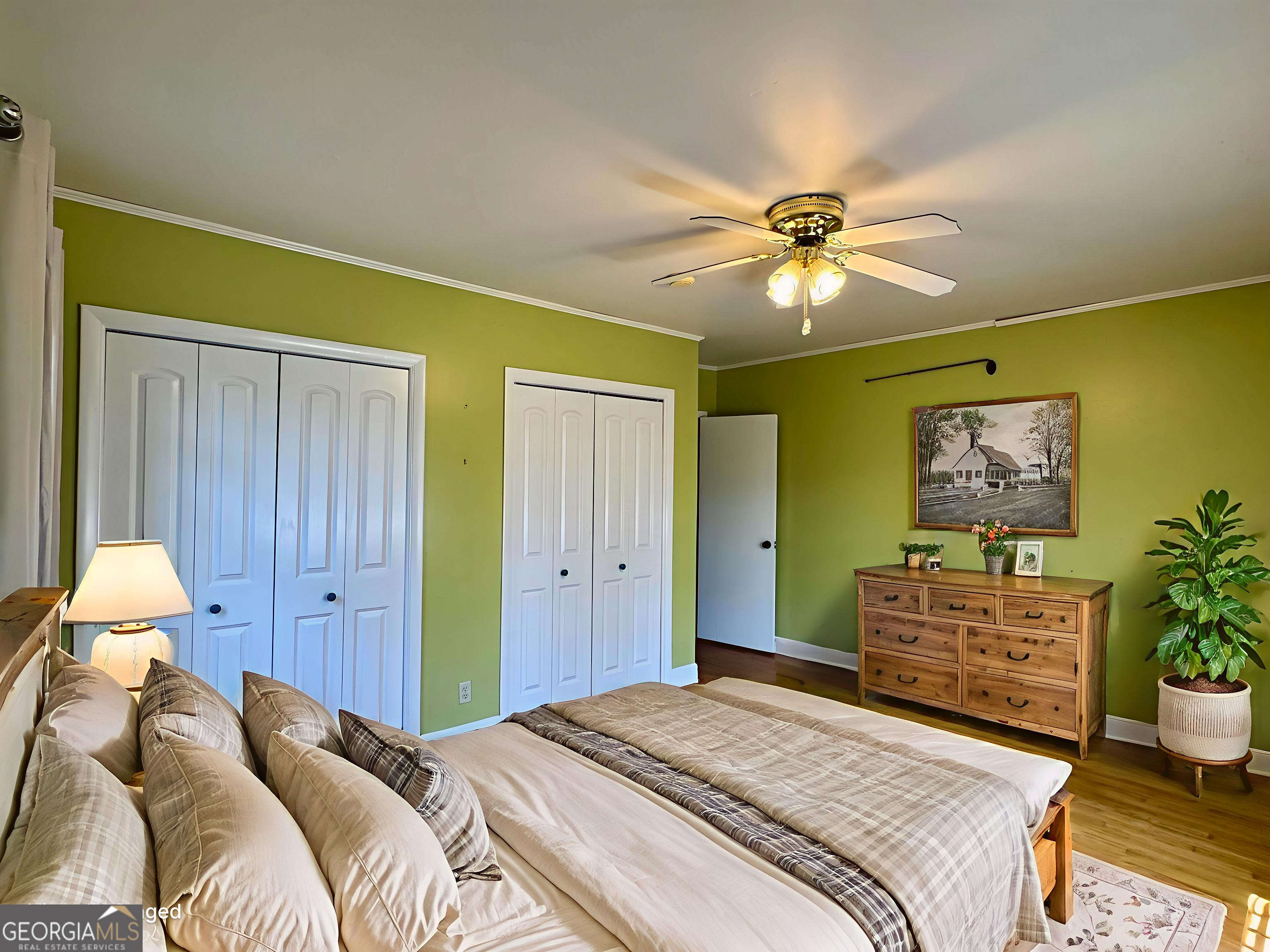 324 North Rhodes Street Union Point, GA 30669 - Photo 55 of 94 a bedroom with a bed dresser and a window