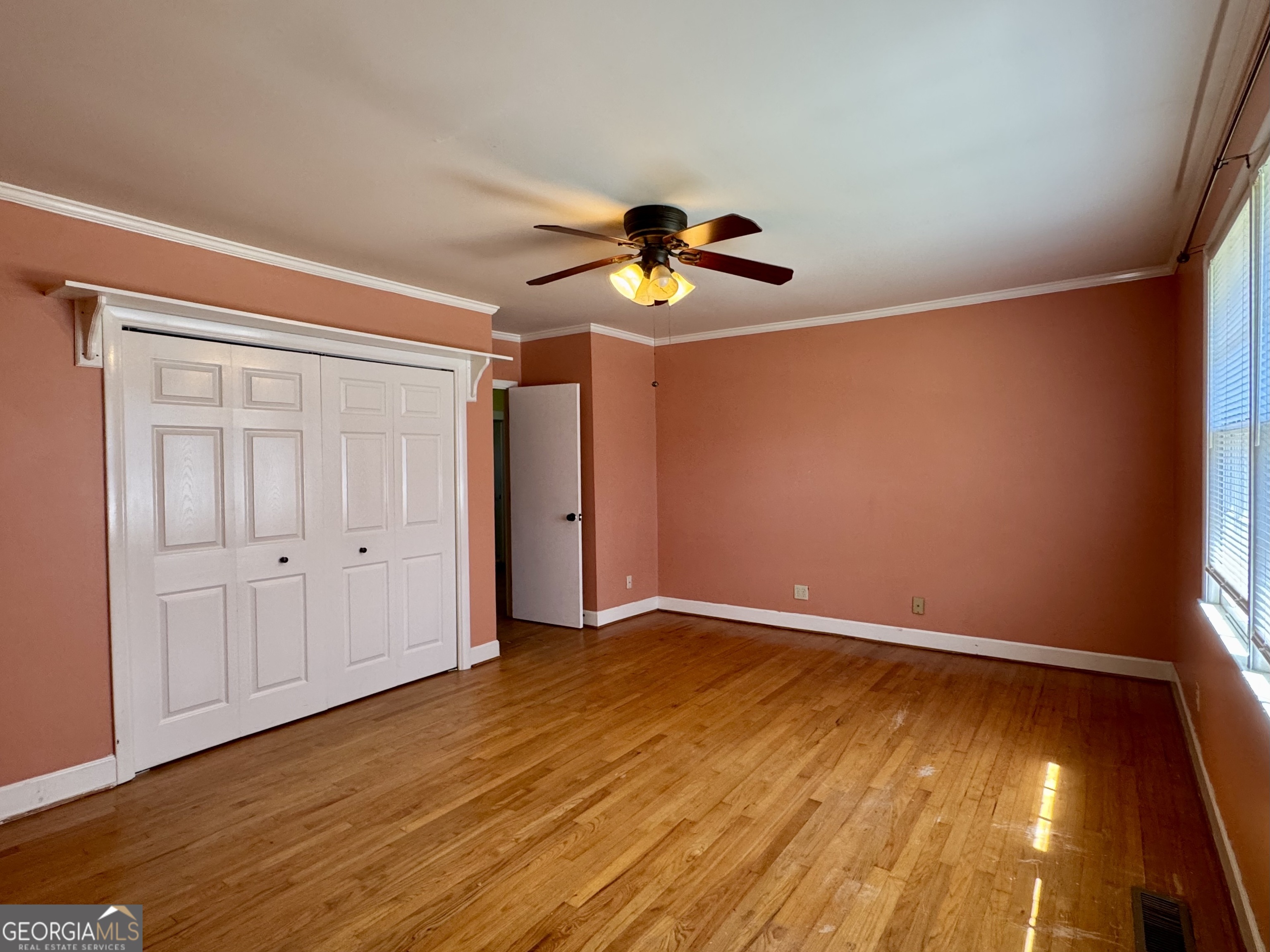 324 North Rhodes Street Union Point, GA 30669 - Photo 59 of 94 wooden floor in an empty room with a window
