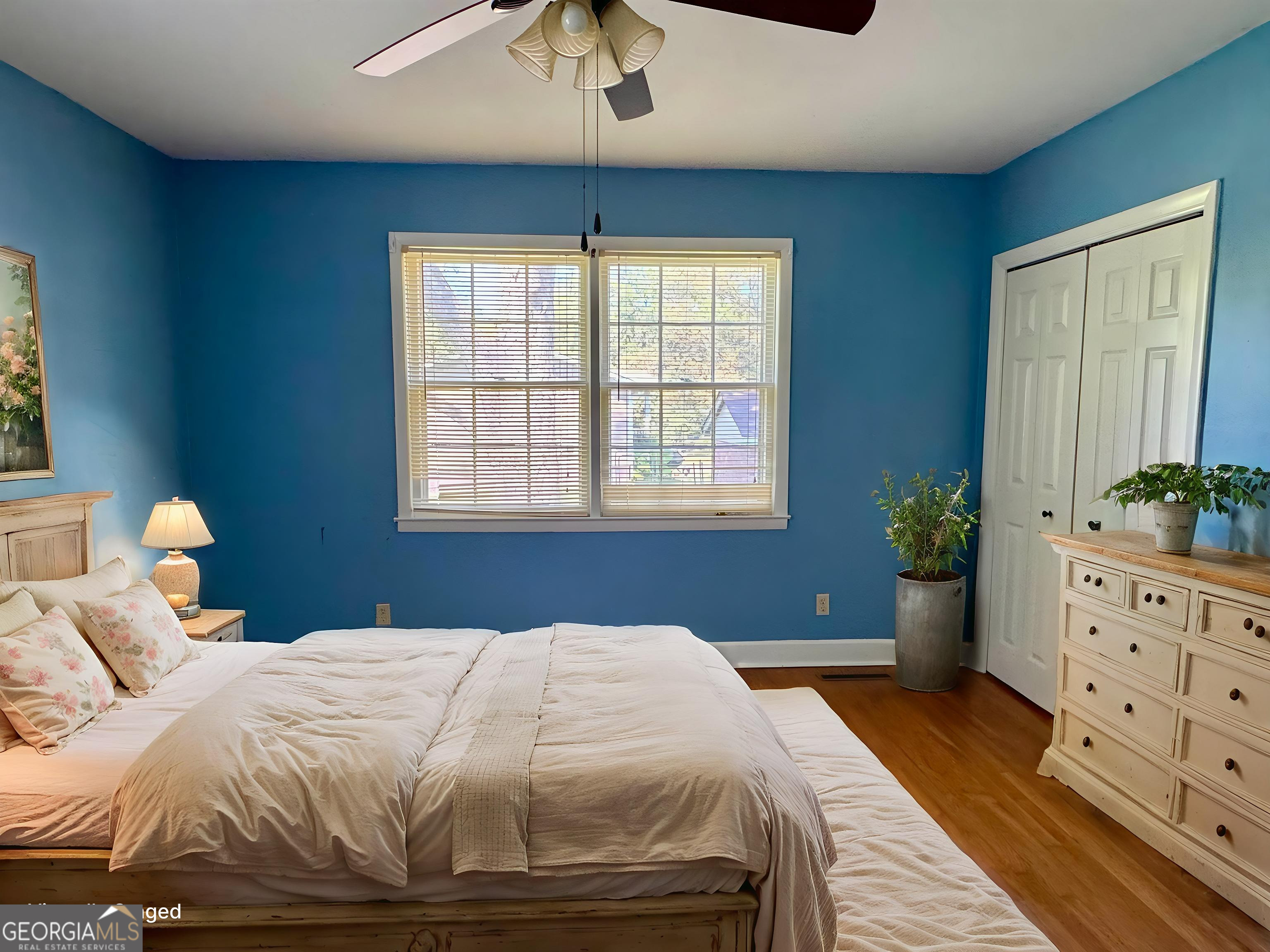 324 North Rhodes Street Union Point, GA 30669 - Photo 74 of 94 a bedroom with a bed and a window