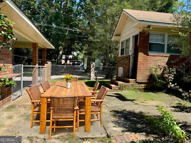 a view of a room with wooden floor and chandelier
