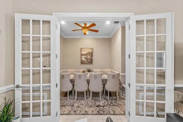 a dining room with a table and chairs