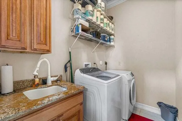 a bathroom with a granite countertop sink a mirror and vanity