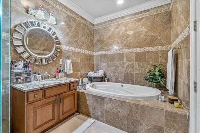 a room with a sink a washer and dryer