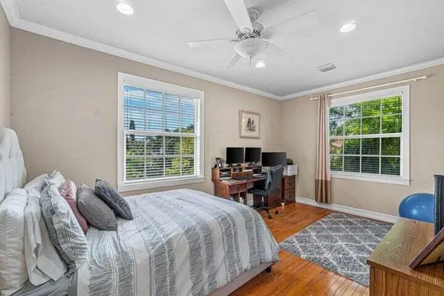 a bedroom with a bed and a table in it