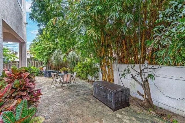 a backyard of a house with outdoor seating