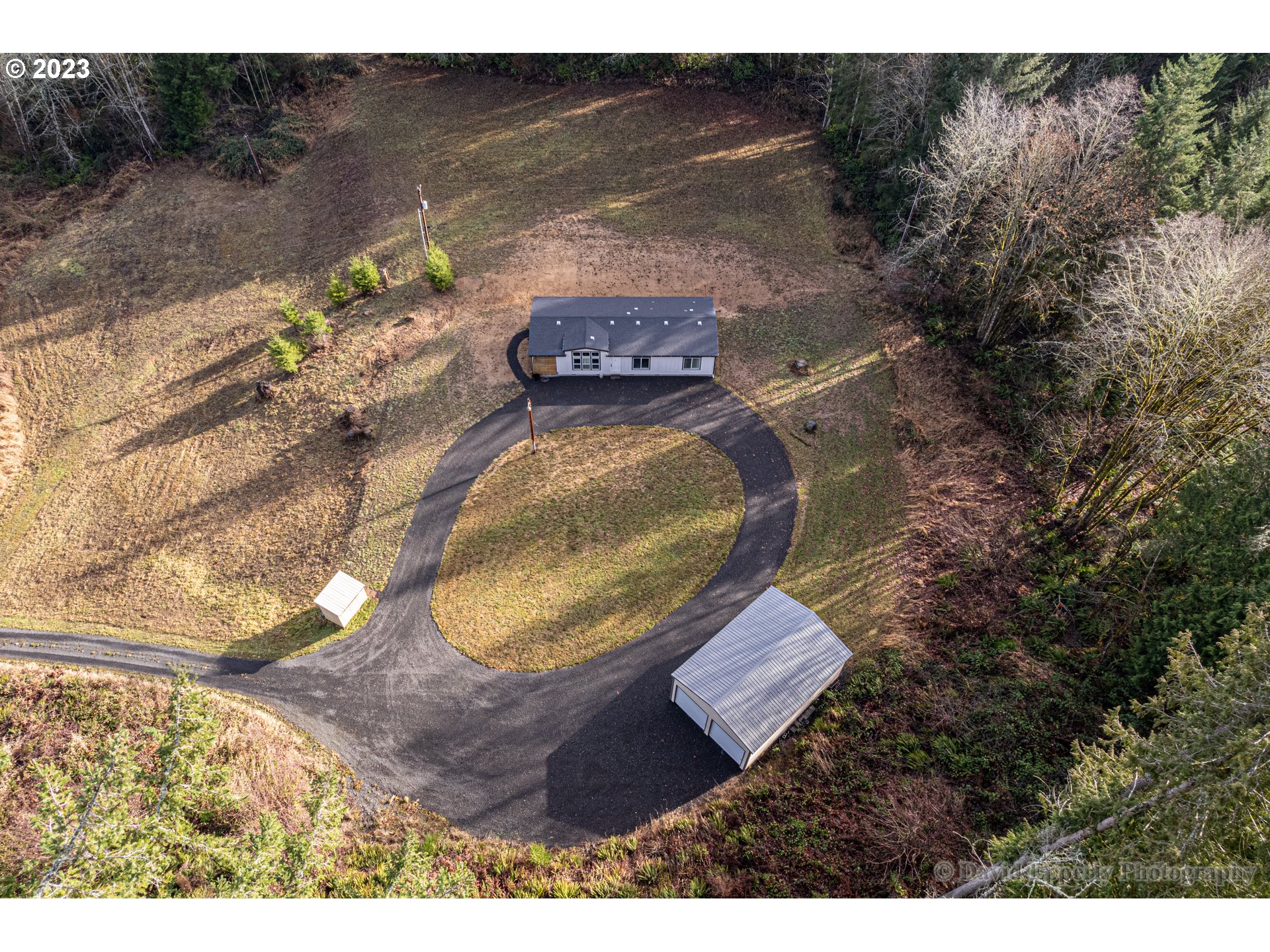 a aerial view of a house with a yard basket ball court