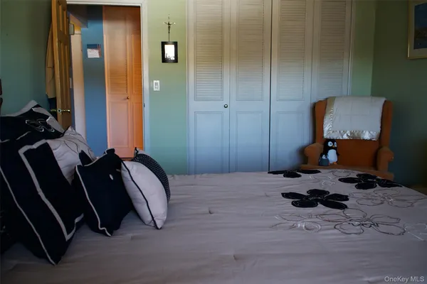 a bedroom with a bed and gym equipment