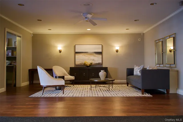 a living room with furniture rug and window