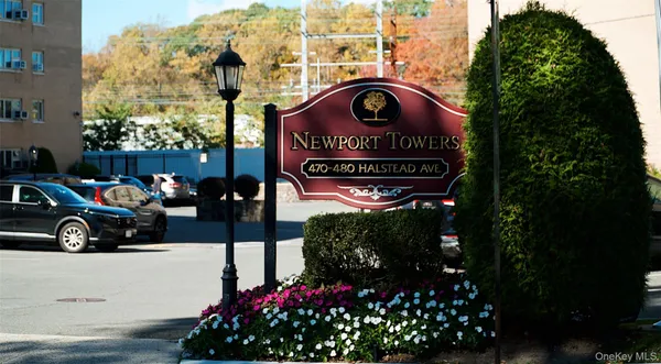 a view of outdoor space with sign board and buildings