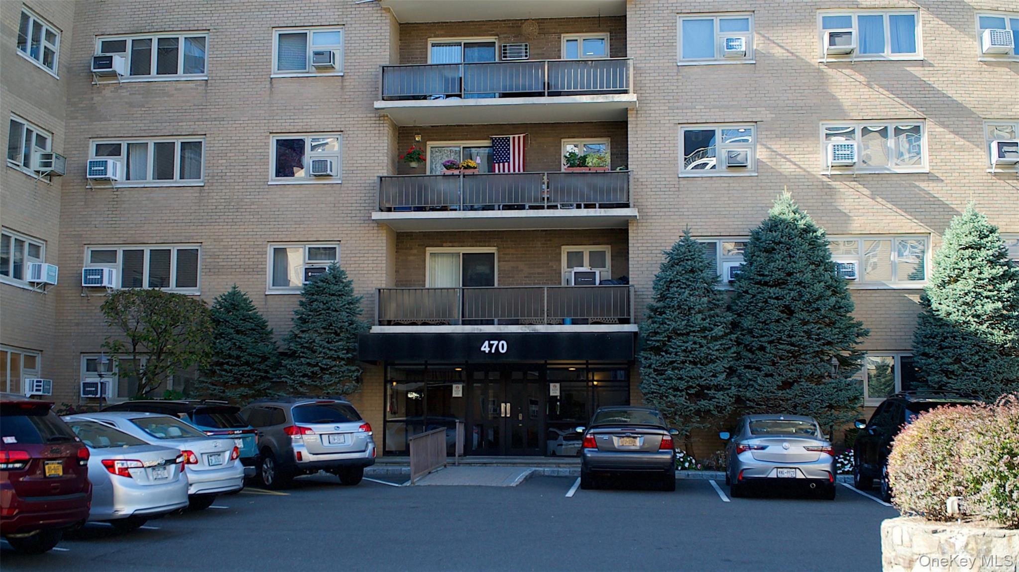 470 Halstead Avenue, Unit 6V Harrison, NY 10528 - Photo 2 of 20 a car parked in front of a building