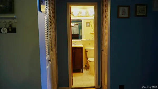a bathroom with a glass door and a shower
