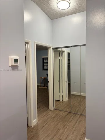 a view of entryway with wooden floor