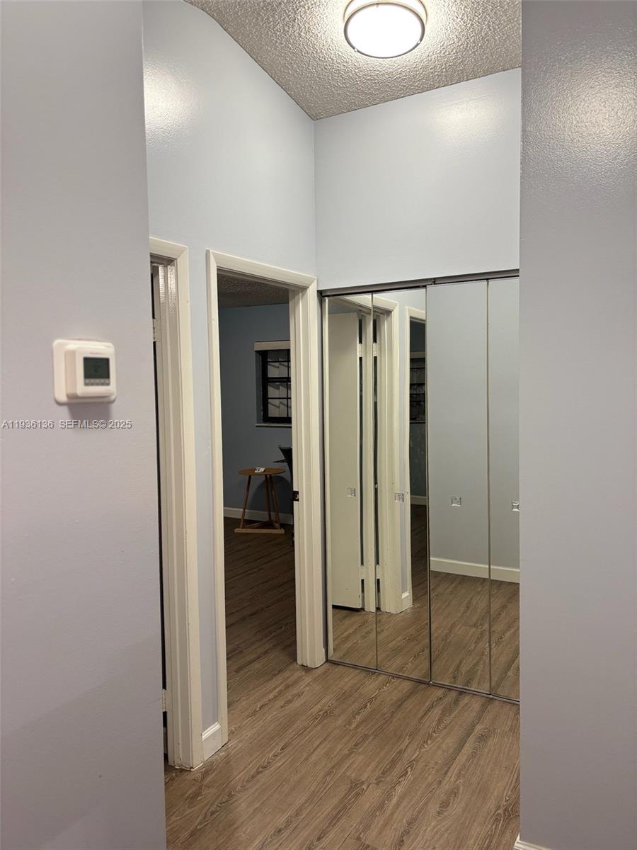 6460 Northwest 192nd Terrace, Unit 6460 Hialeah, FL 33015 - Photo 15 of 42 a view of entryway with wooden floor
