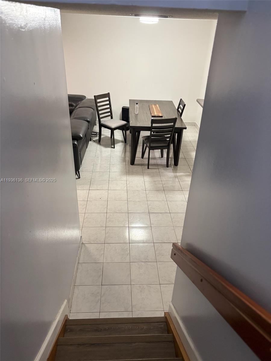 6460 Northwest 192nd Terrace, Unit 6460 Hialeah, FL 33015 - Photo 20 of 42 a view of a workspace with furniture and wooden floor