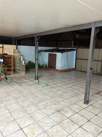 a kitchen with a sink a stove a counter space and cabinets