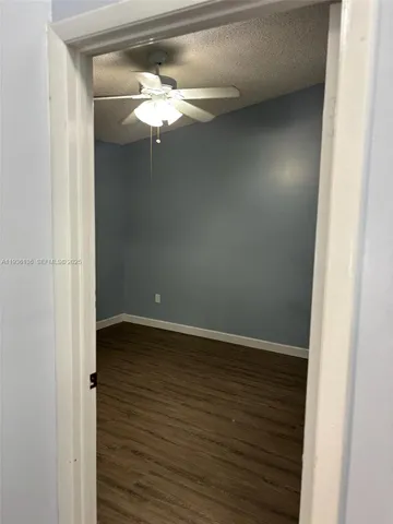 a view of a small space with wooden floor