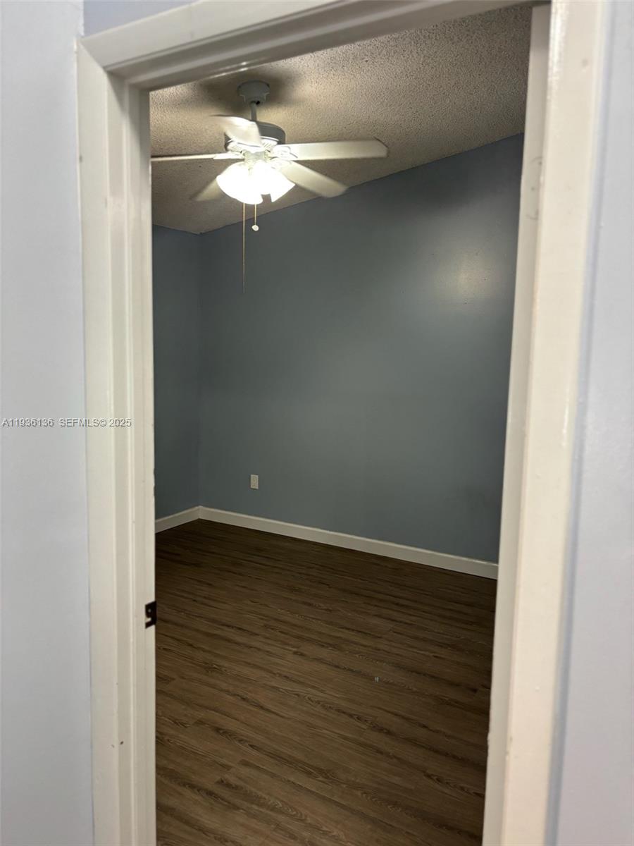 6460 Northwest 192nd Terrace, Unit 6460 Hialeah, FL 33015 - Photo 9 of 42 a view of a small space with wooden floor