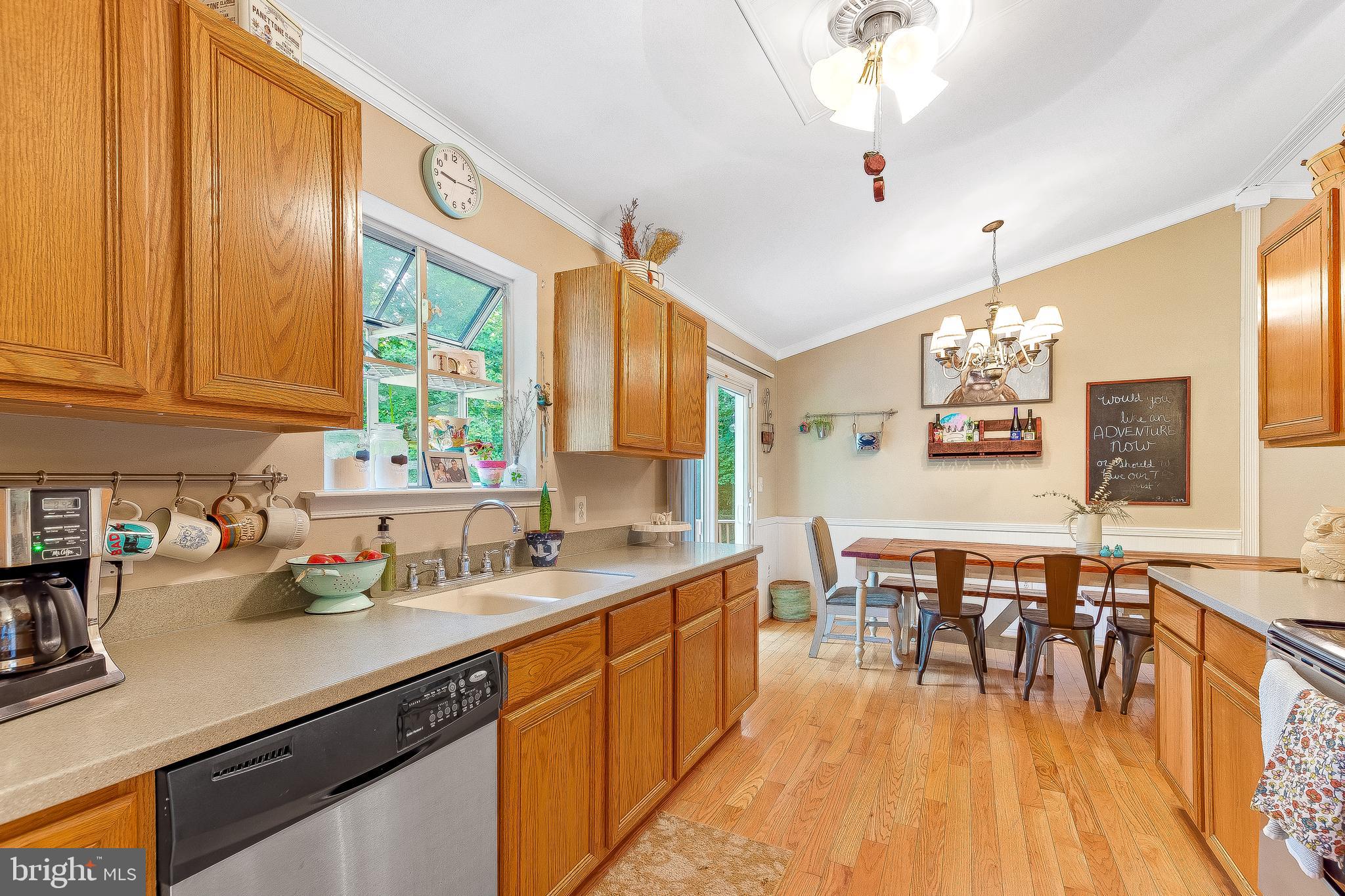 11356 Redlands Road Lusby, MD 20657 - Photo 7 of 36 a kitchen with lots of counter top space and dining table