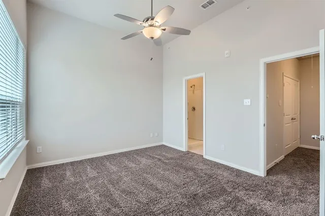 a view of a livingroom with a chandelier fan
