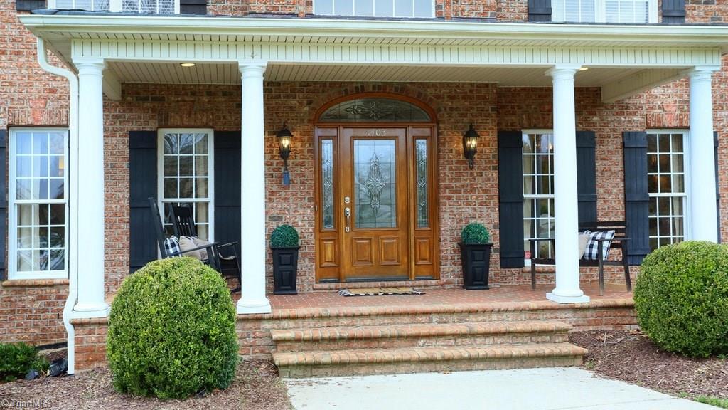 8403 Oakchester Court Oak Ridge, NC 27310 - Photo 2 of 18 This home has a great front porch to sit and relax on. What a great place to enjoy and say hello to neighbors as they pass by...
