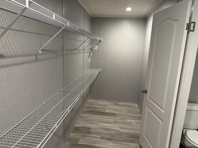 a kitchen with a refrigerator and cabinets