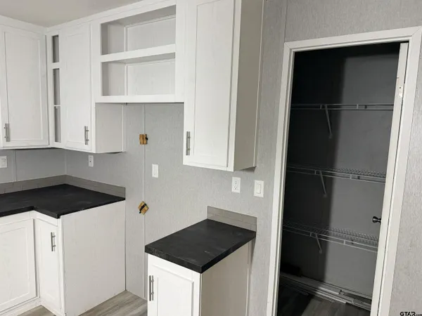 a kitchen with a stove and a cabinet