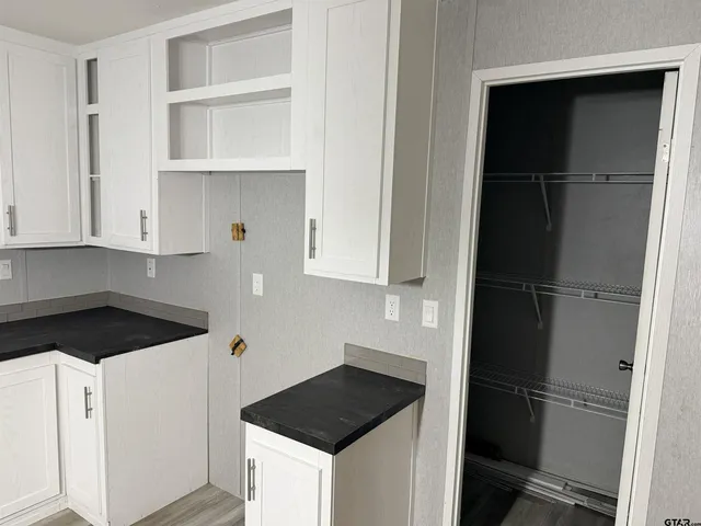 a kitchen with a stove and a cabinet