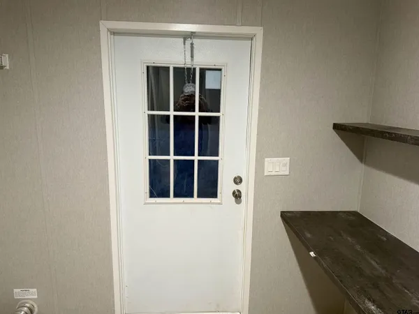 a view of a bedroom with wooden floor and closet