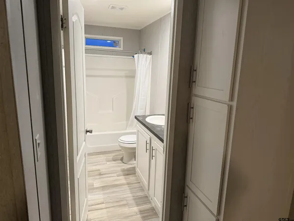 a bathroom with a toilet