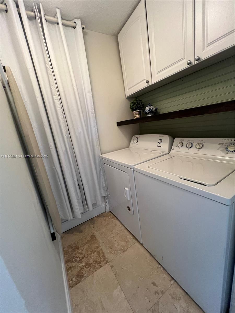 6198 Brandon Street, Unit 6198 Palm Beach Gardens, FL 33418 - Photo 26 of 26 a utility room with dryer and washer