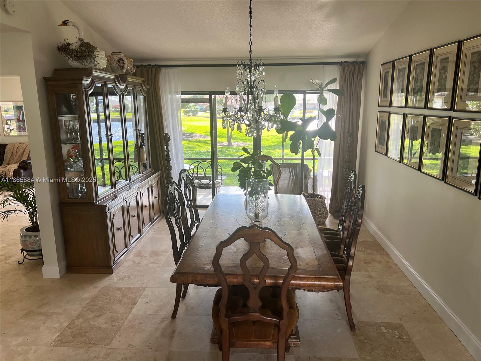 6198 Brandon Street, Unit 6198 Palm Beach Gardens, FL 33418 - Photo 9 of 26 a view of a dining room with furniture window and outside view