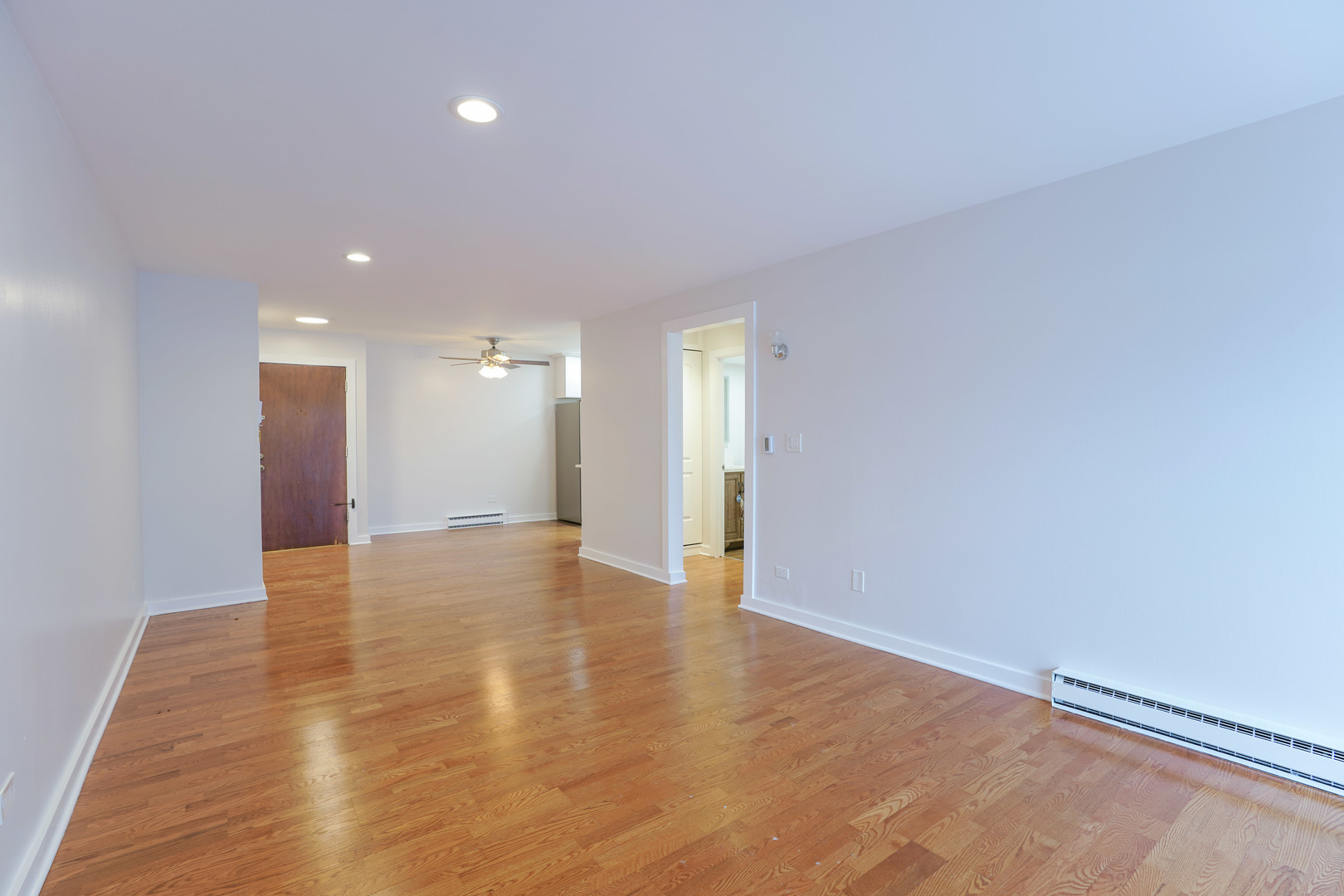 816 East Old Willow Road, Unit 112 Prospect Heights, IL 60070 - Photo 5 of 17 a view of an empty room with wooden floor